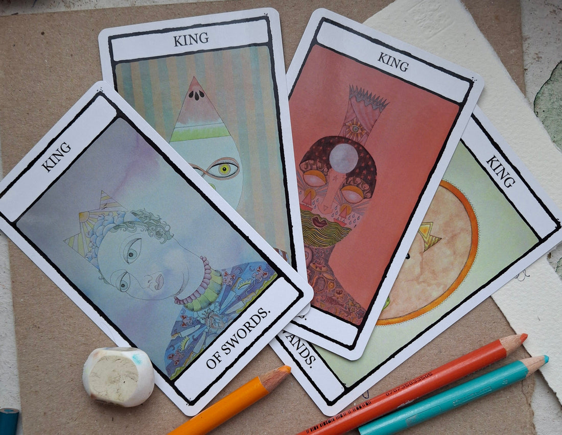 Four hand-illustrated King tarot cards from The Falling Card Tarot deck by Jenni McLaughlin, featuring the King of Wands, King of Cups, King of Swords, and King of Pentacles.