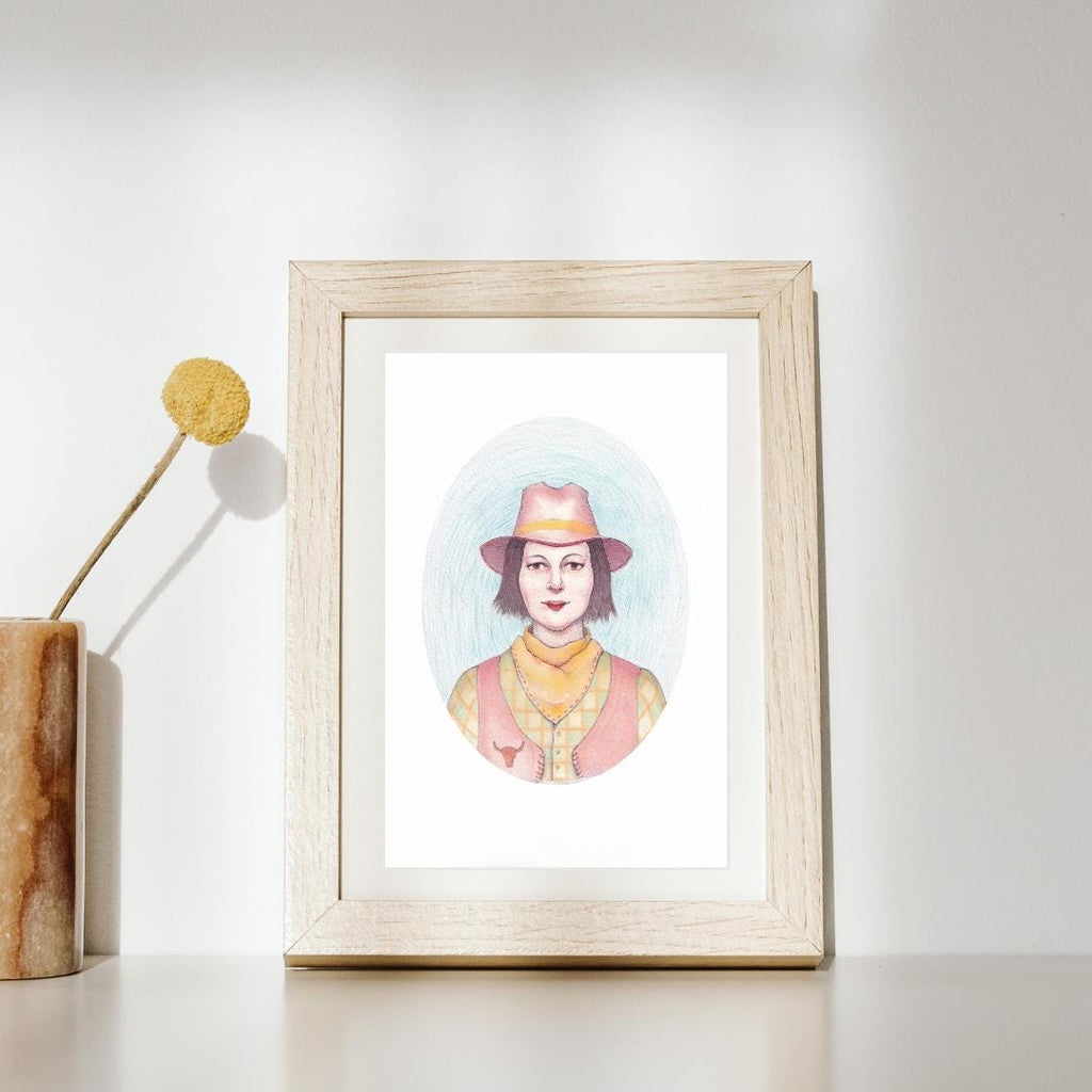 Taurus art print of a woman wearing a hat on a white surface with a blue background