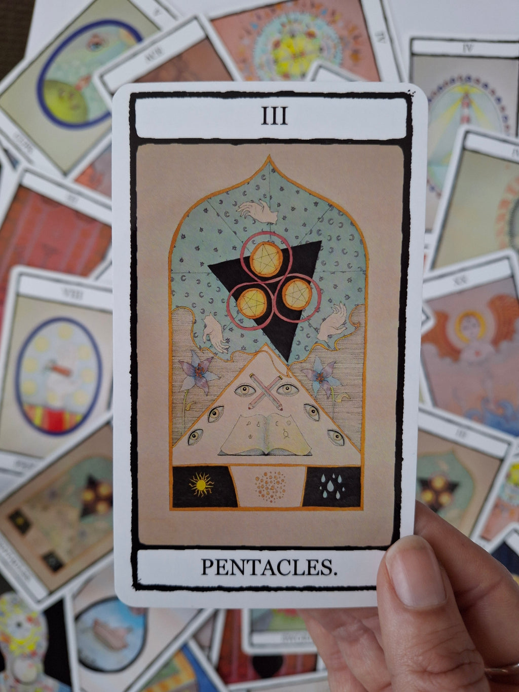 Card from a hand illustrated tarot deck, featuring witchy art  and the words 3 Pentacles