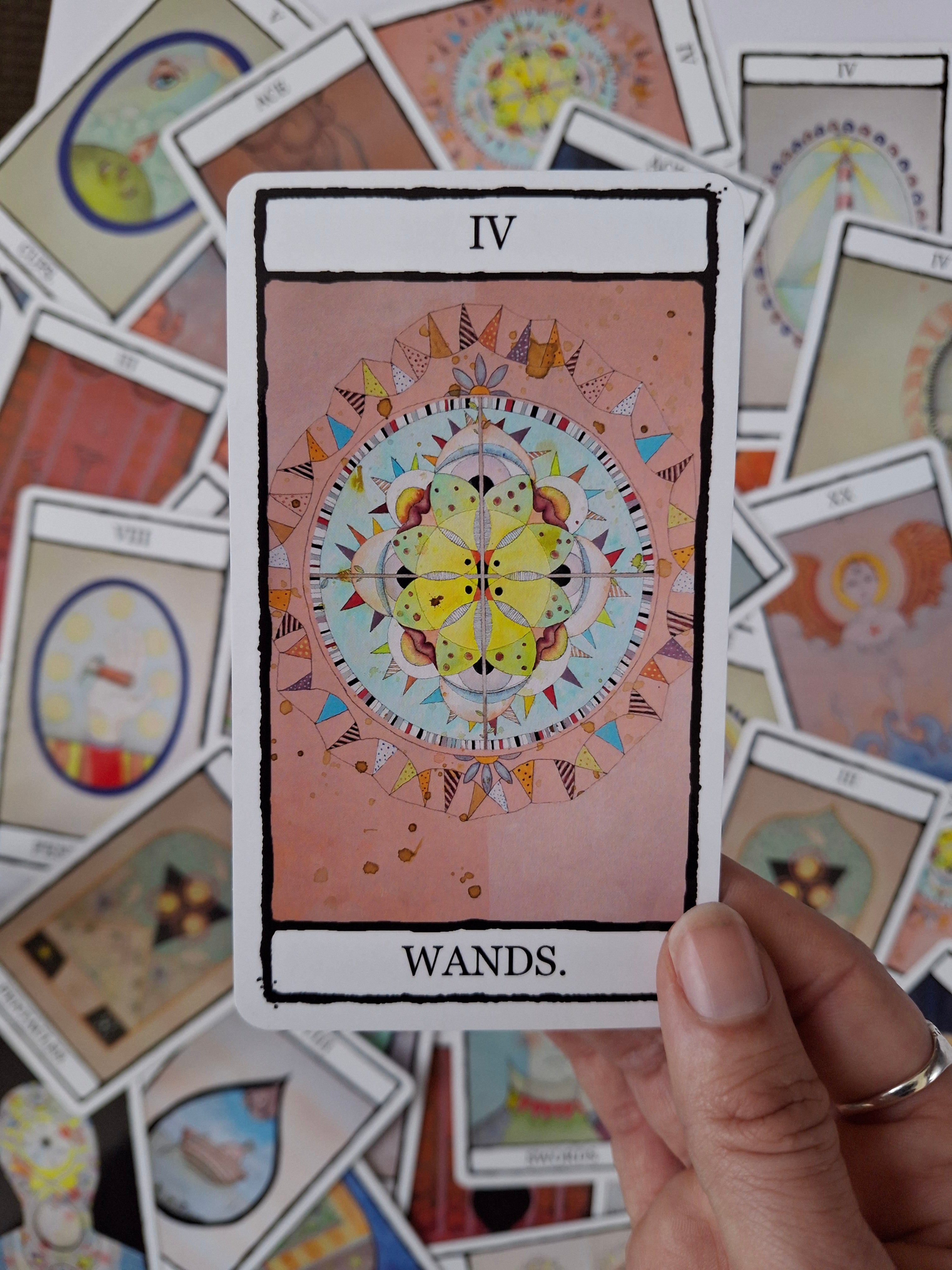 4 of Wands tarot card with hand painted illustration of a colourful kaleidoscope with eyes, lips and flags