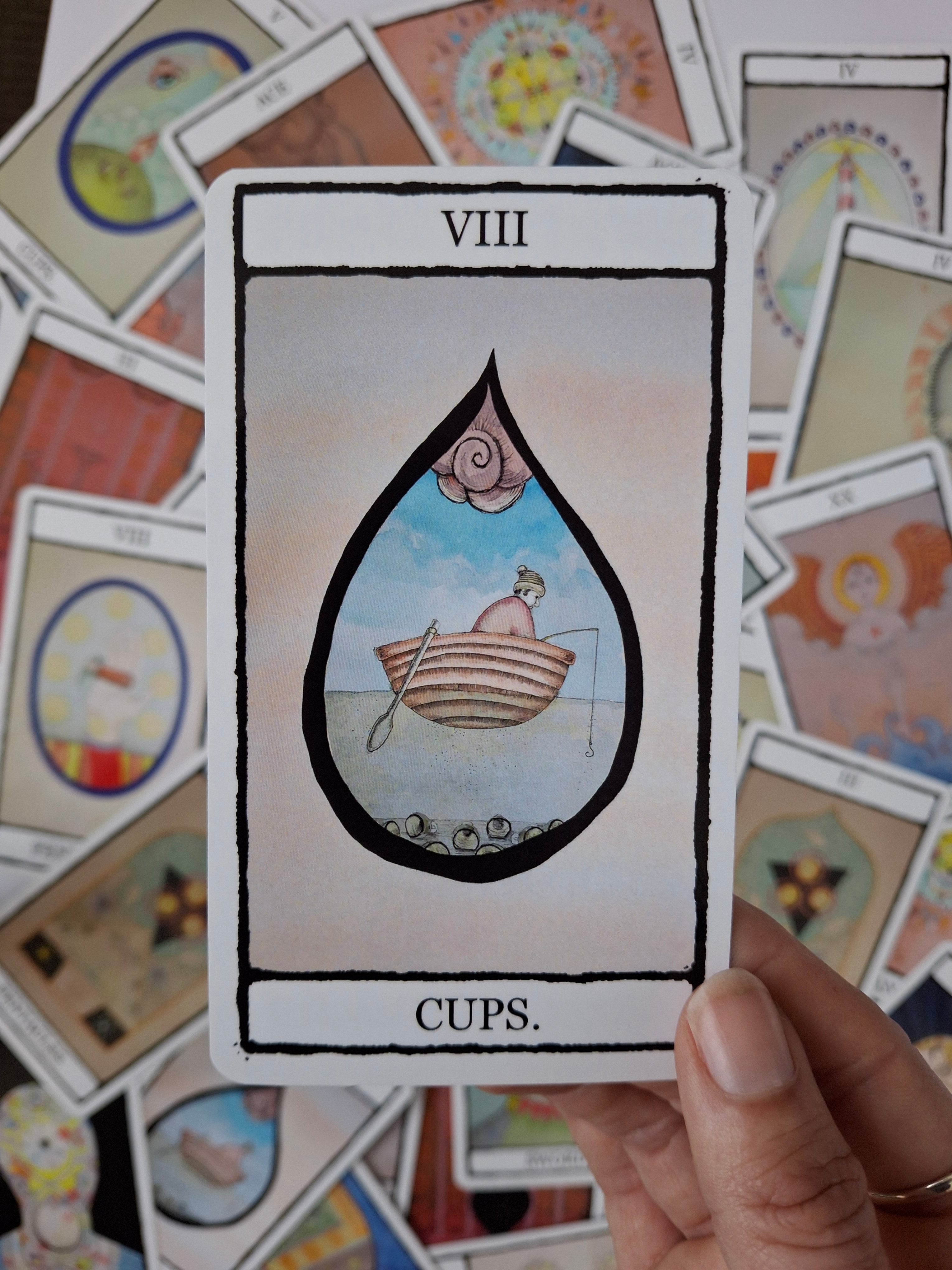 Hand illustrated 8 of Cps tarot card with picture of a whimsical boat and solemn figure fishing