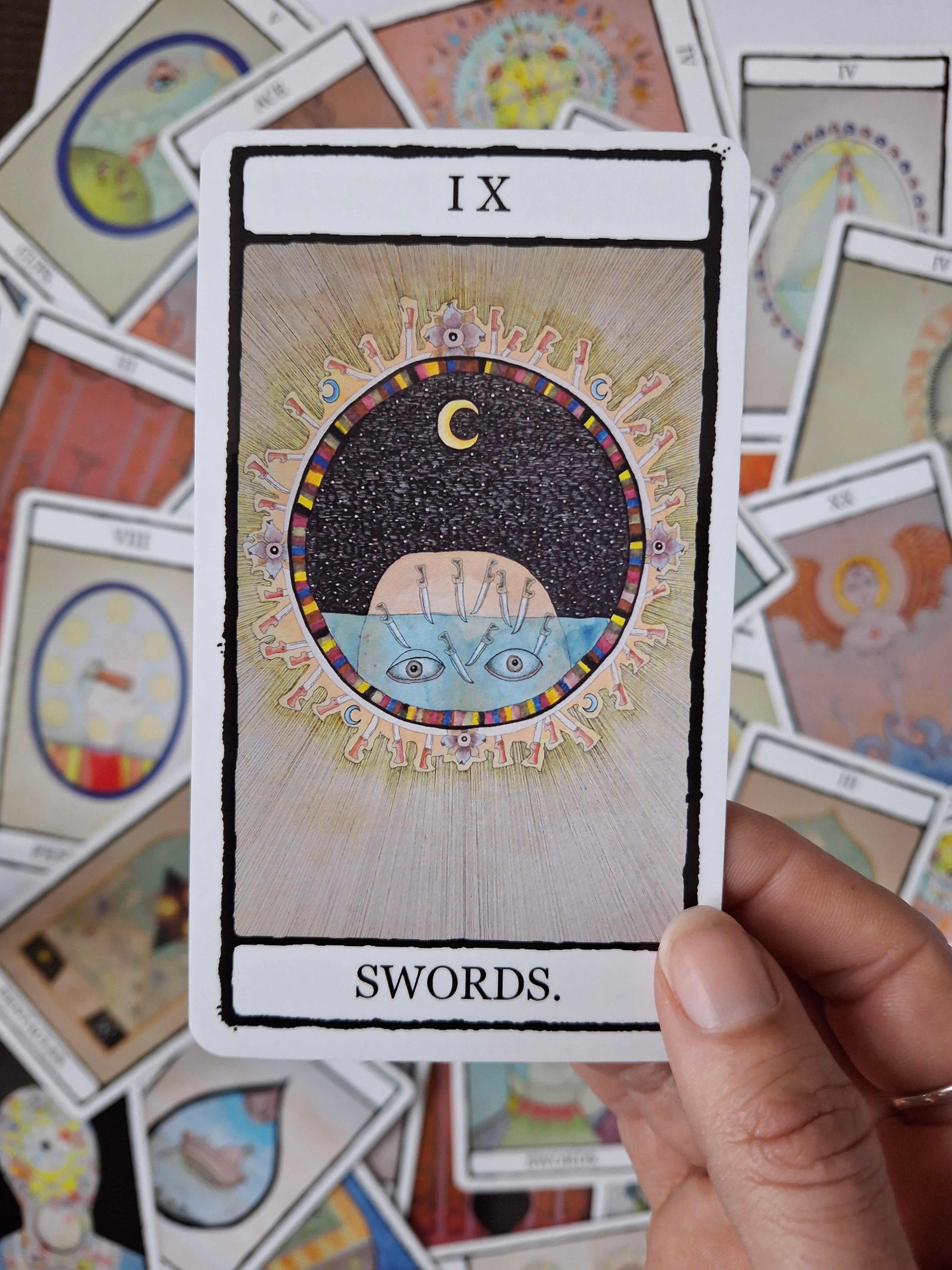 Tarot card featuring 9 of Swords illustration with a black sky, swords and green background