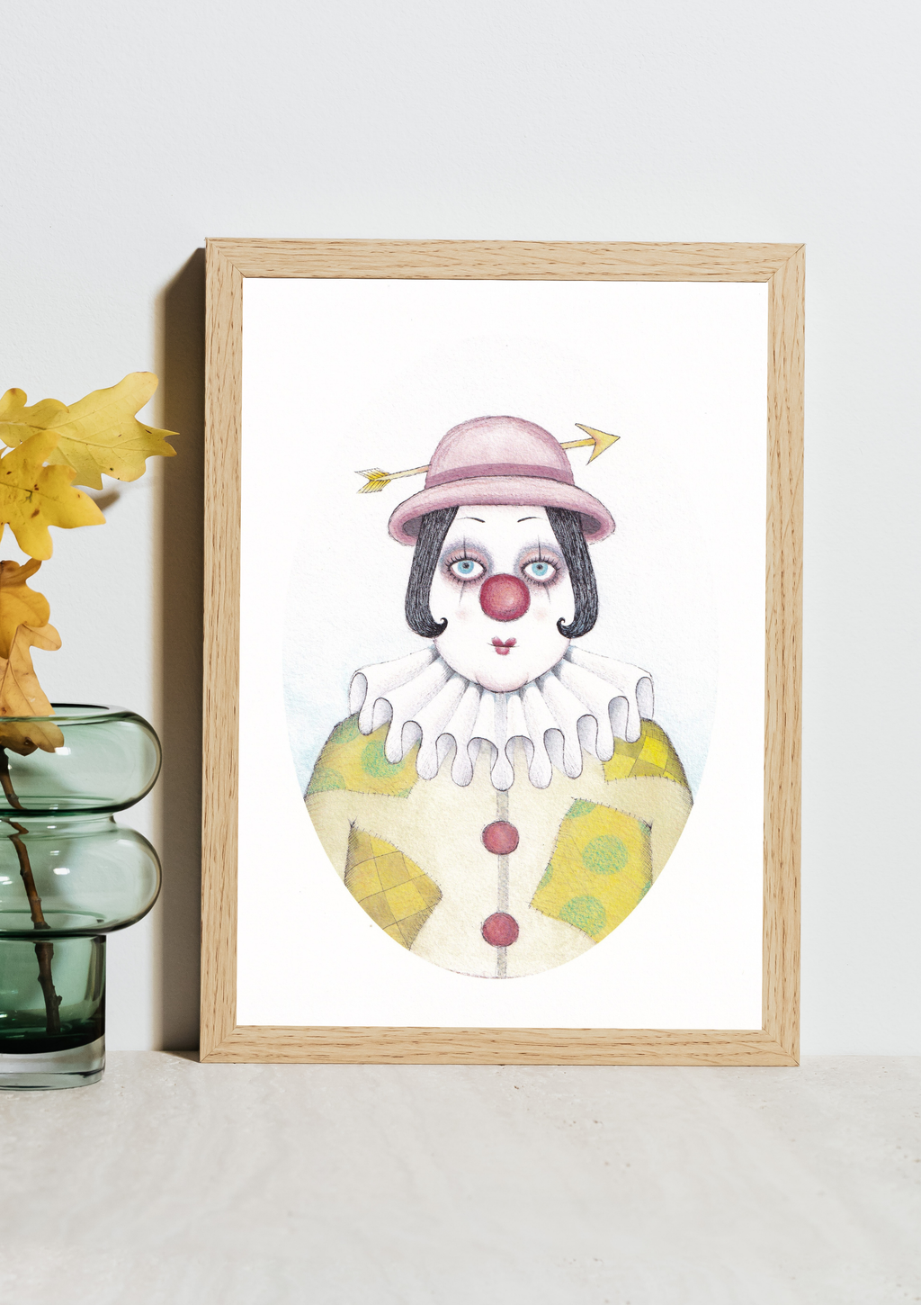 Dark whimsical Sagittarius art print of a clown with a pink hat on a white wall.