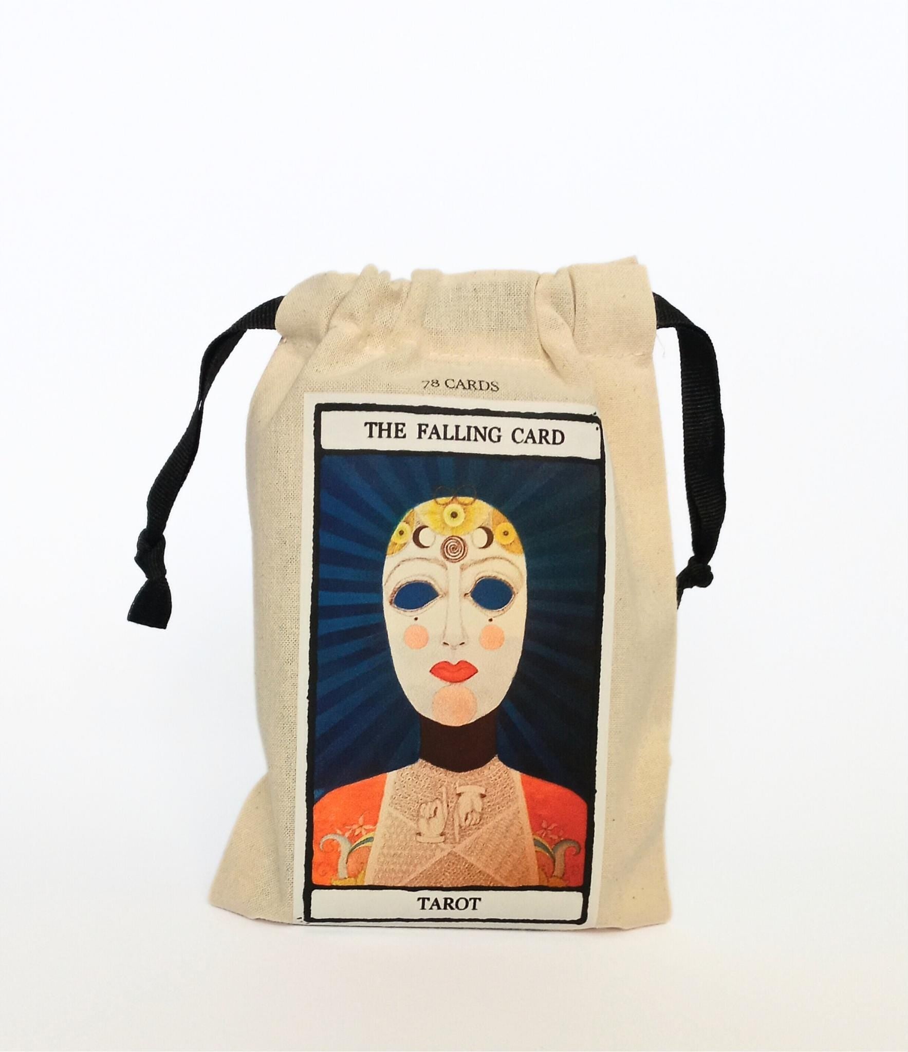 Tarot card deck with 'The Falling Card Tarot' design on a drawstring bag against a white background